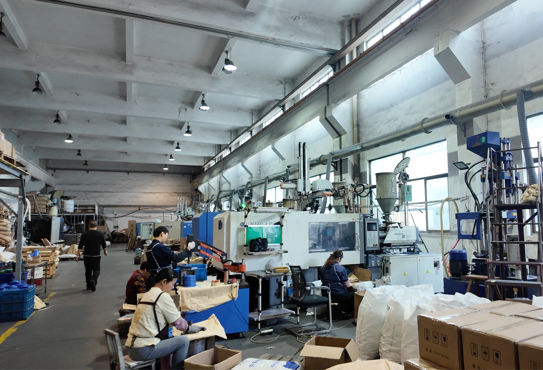 Actual Letong injection molding workshop with production machines and operators